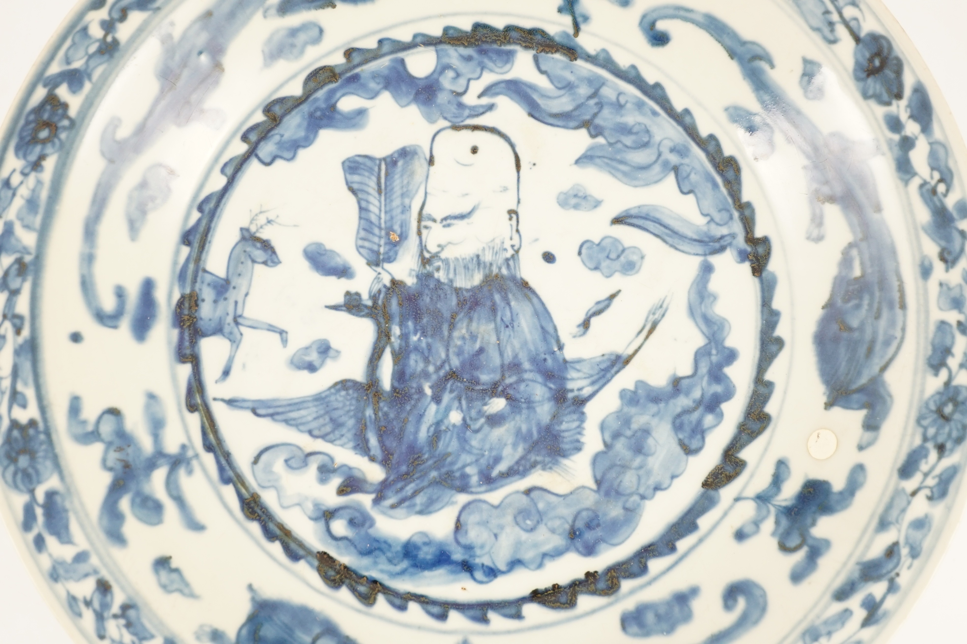 A large Chinese Swatow blue and white ‘Shou Lao’ dish, Zhangzhou kilns, Wanli period, 43.4cm diameter, tiny rim chip